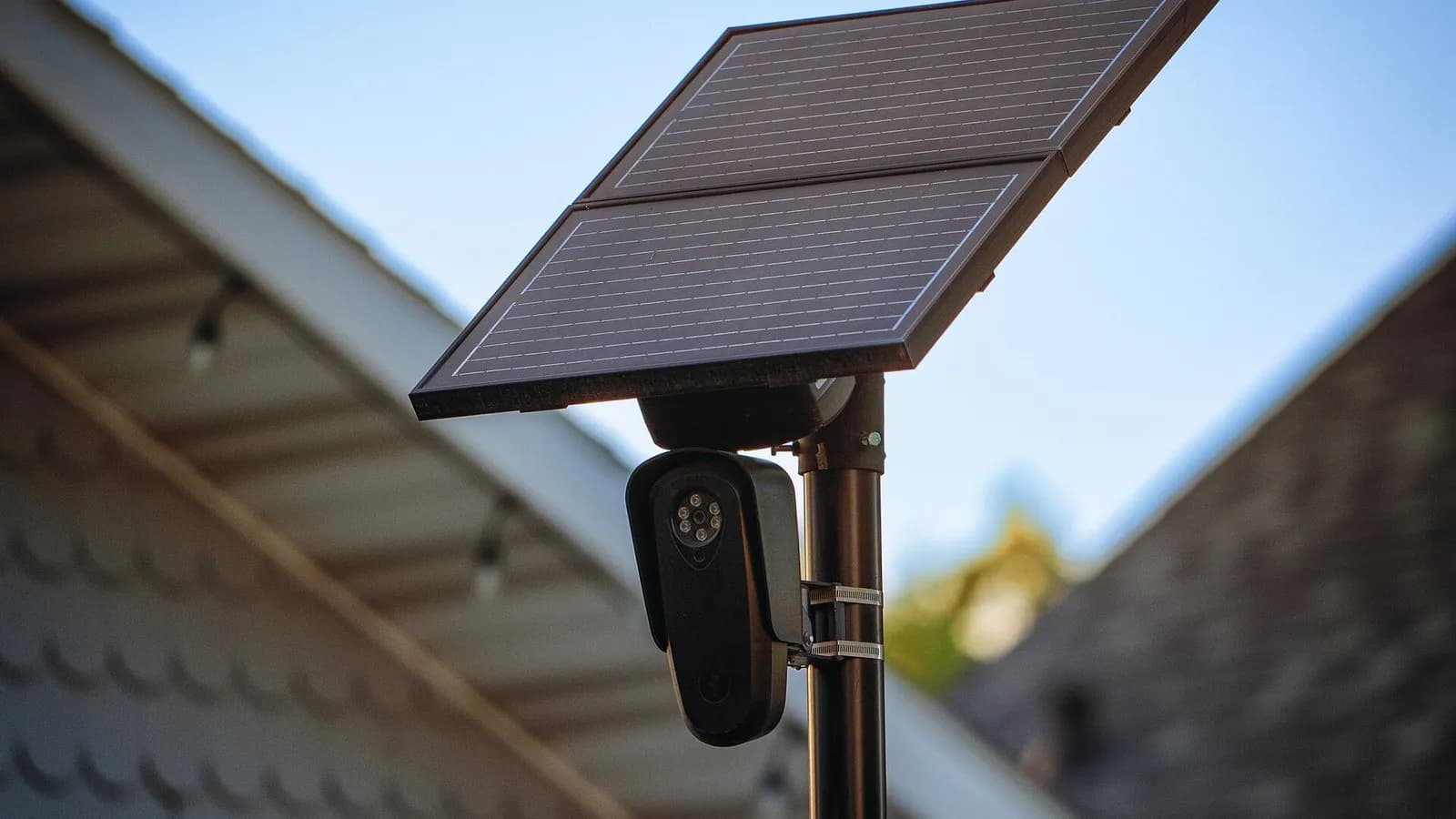 A Flock Safety automatic licence plate recognition camera with a solar panel mounted on a pole along 5th Avenue in Kearney, Nebraska, photographed on 29 April 2025, a file photograph of the camera type and not of any location on MapQuest's map