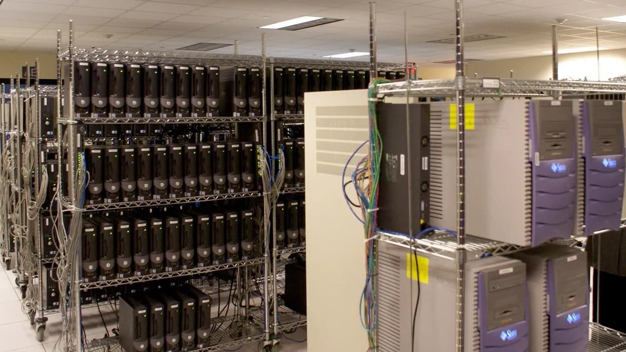 Rows of wire shelving holding computer servers in a large server room, photographed on 23 January 2008, a file photograph illustrative of computing infrastructure and not of OpenAI's systems