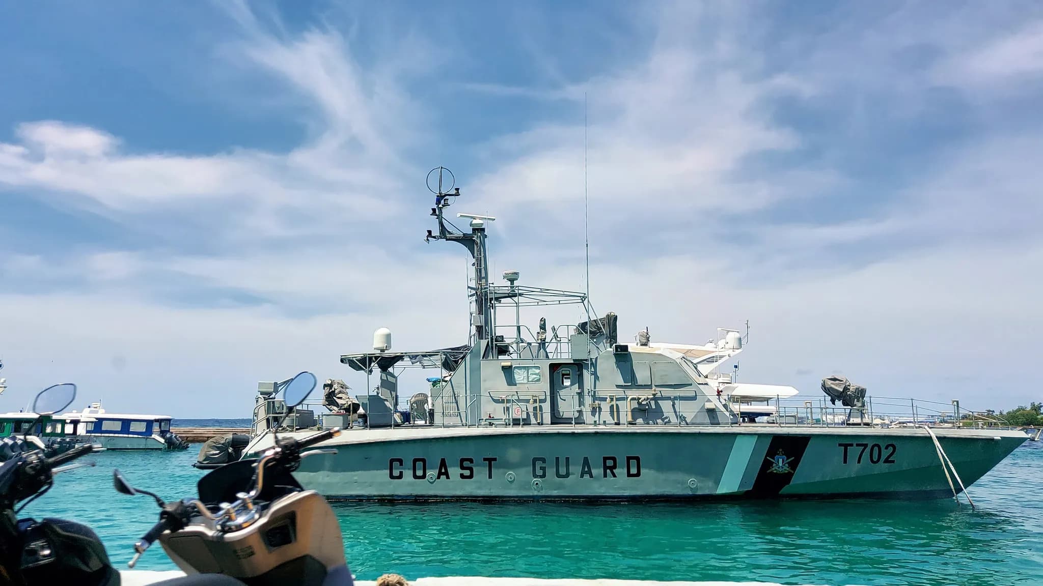 A Maldives maritime rescue team preparing diving equipment aboard a patrol vessel