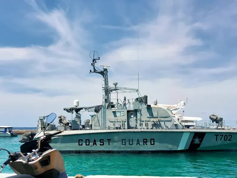 A Maldives maritime rescue team preparing diving equipment aboard a patrol vessel