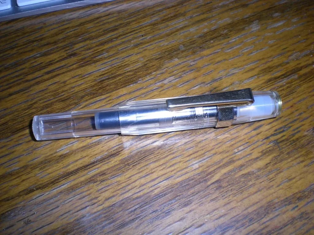 Two unbranded weekly injection pens placed side by side on a clinical white surface