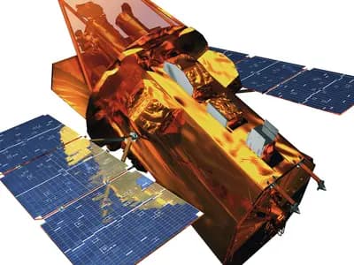 A NASA computer model of the Swift gamma-ray burst observatory showing its gold-wrapped telescope tube and blue solar panels against a white background, an illustration of the spacecraft and not a photograph taken in orbit