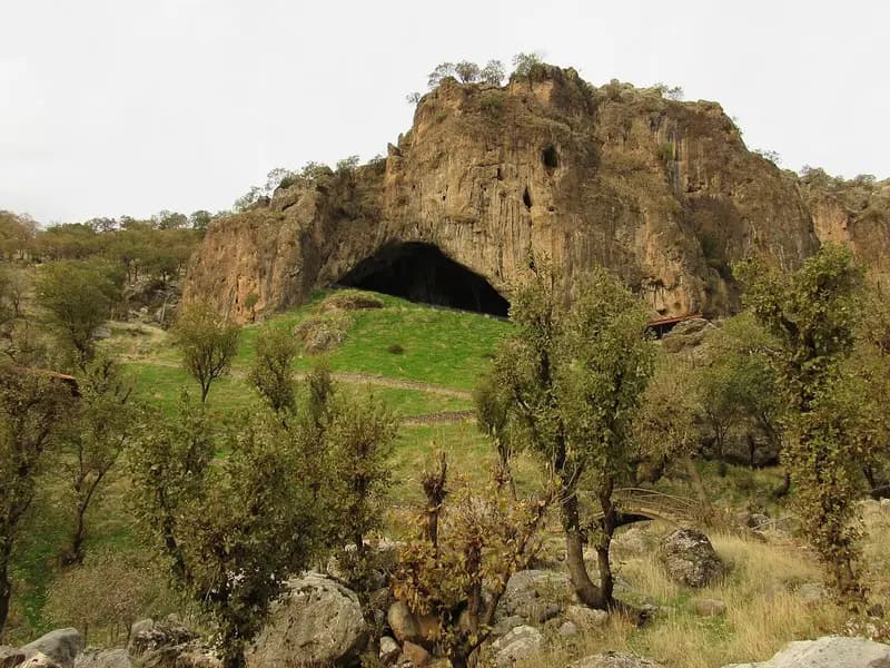 The rock outcrop and cave mouth of Shanidar Cave on Bradost Mountain in Iraqi Kurdistan, seen from the hillside, photographed on 28 November 2020, a file photograph of the site and not of the excavation or the bone
