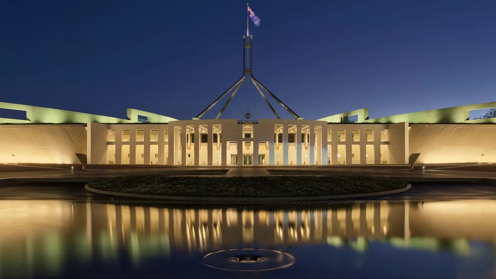 Australia's Parliament House in Canberra, seat of the government that disclosed the Medicare portal breach, photographed at dusk in April 2017