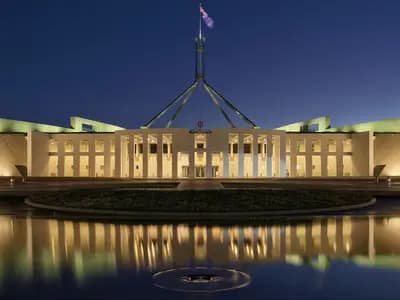 Australia's Parliament House in Canberra, seat of the government that disclosed the Medicare portal breach, photographed at dusk in April 2017