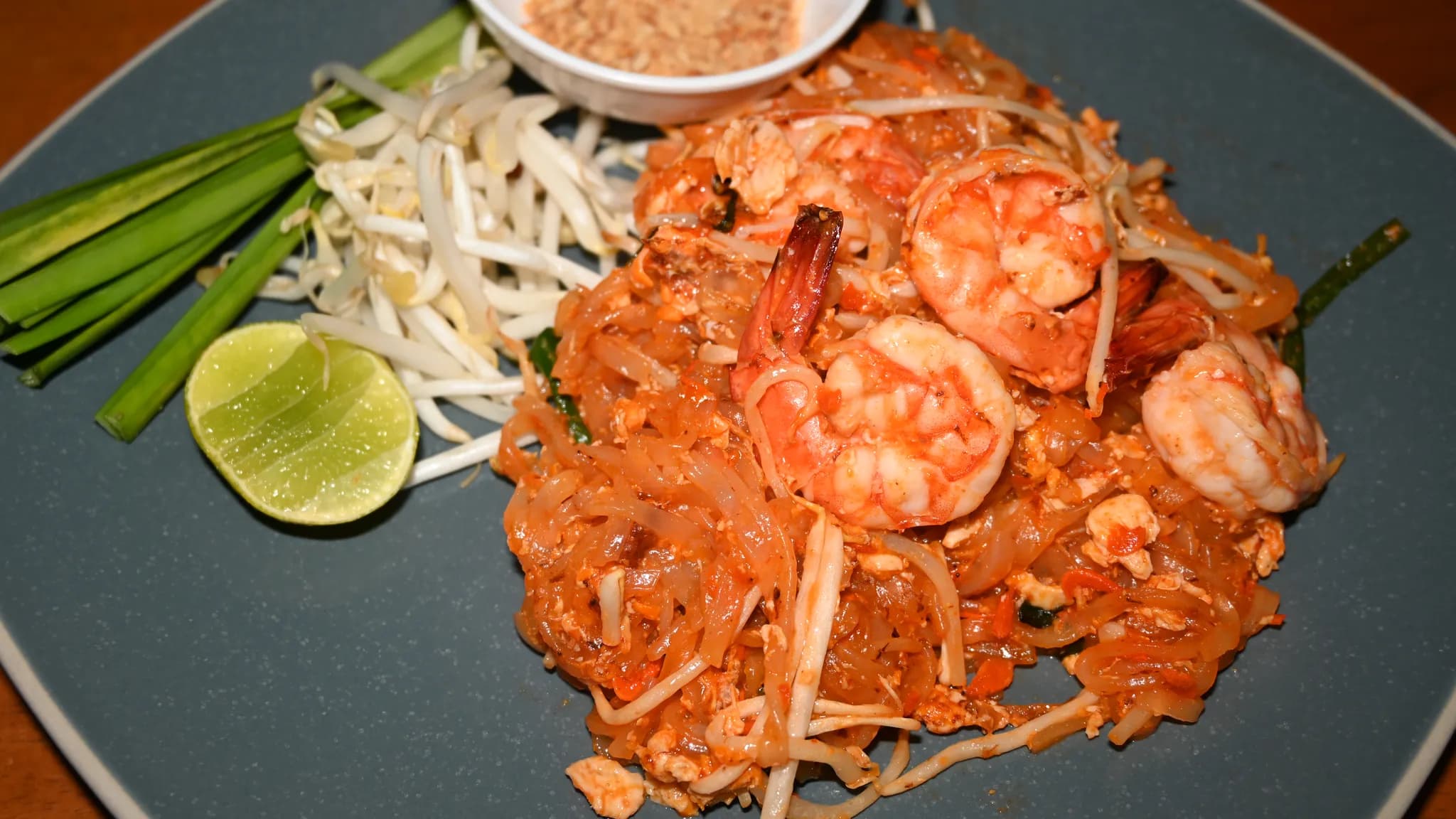Pad Thai noodles with shrimp, peanuts, and fresh lime