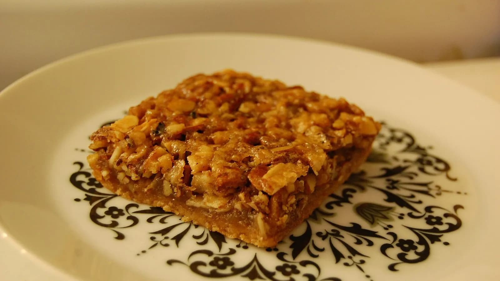 A square pecan bar with a glossy caramelised nut topping on a decorative plate, photographed on 22 September 2011, a file photograph of the dish and not of the Firehouse Subs bar
