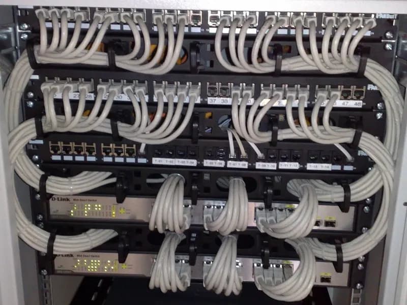 A 19-inch rack of Ethernet switches and patch panels with grey patch cables looped neatly down the sides, photographed on 23 October 2009, a file photograph illustrative of hosting infrastructure and not of any provider named