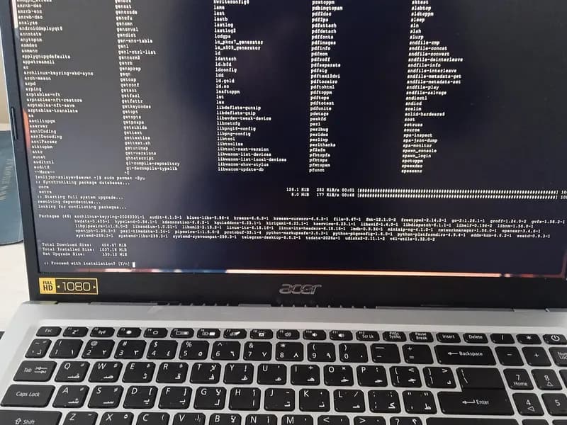 An Acer laptop showing a Linux terminal in the middle of a package update, photographed around 7 March 2026, a file photograph illustrative of updating server software and not of a PHP update