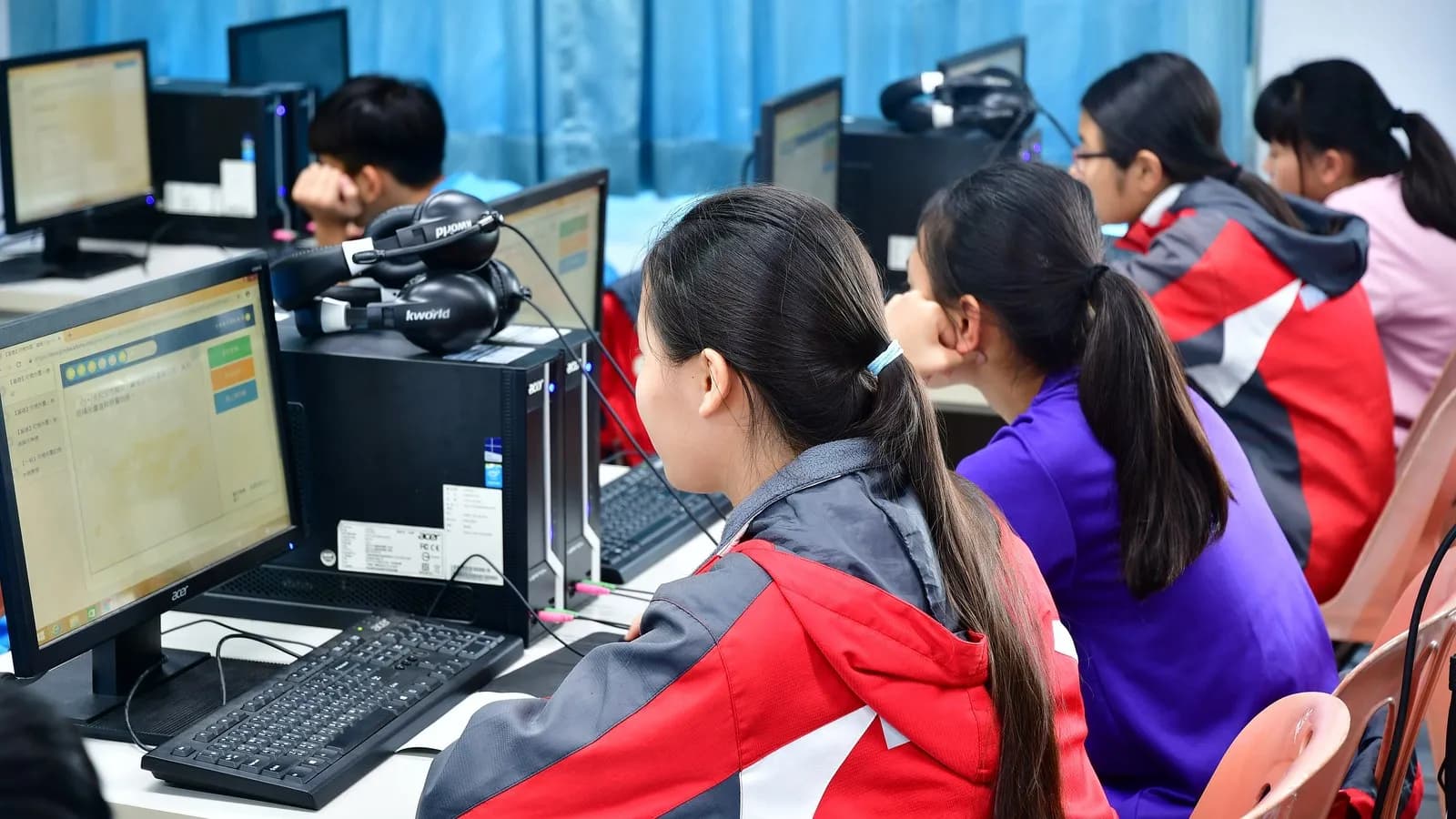 Junior high school students working at computers in a classroom in Taiwan, one of the ninety-one systems that took part in PISA 2025