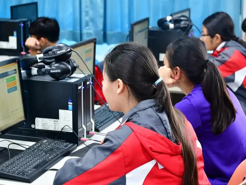 Junior high school students working at computers in a classroom in Taiwan, one of the ninety-one systems that took part in PISA 2025