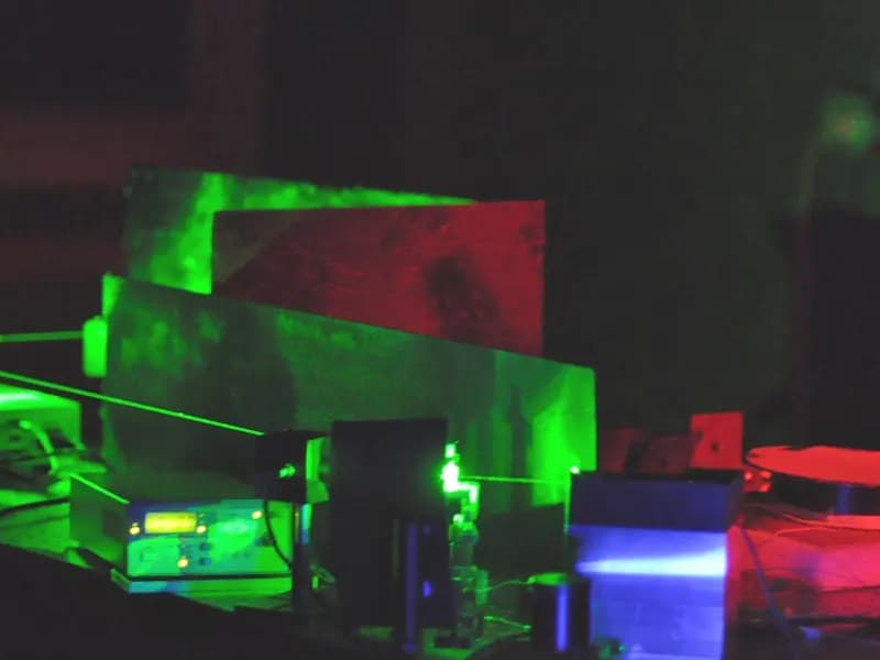 A laser driven photon pair source on an optical bench at NIST, the conventional arrangement this experiment replaced with sunlight