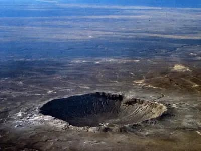 Barringer Crater in Arizona, an aerial view of a well known impact crater illustrative of the type of structure confirmed in Quebec, and not the Uhackatik site itself, photographed by the USGS