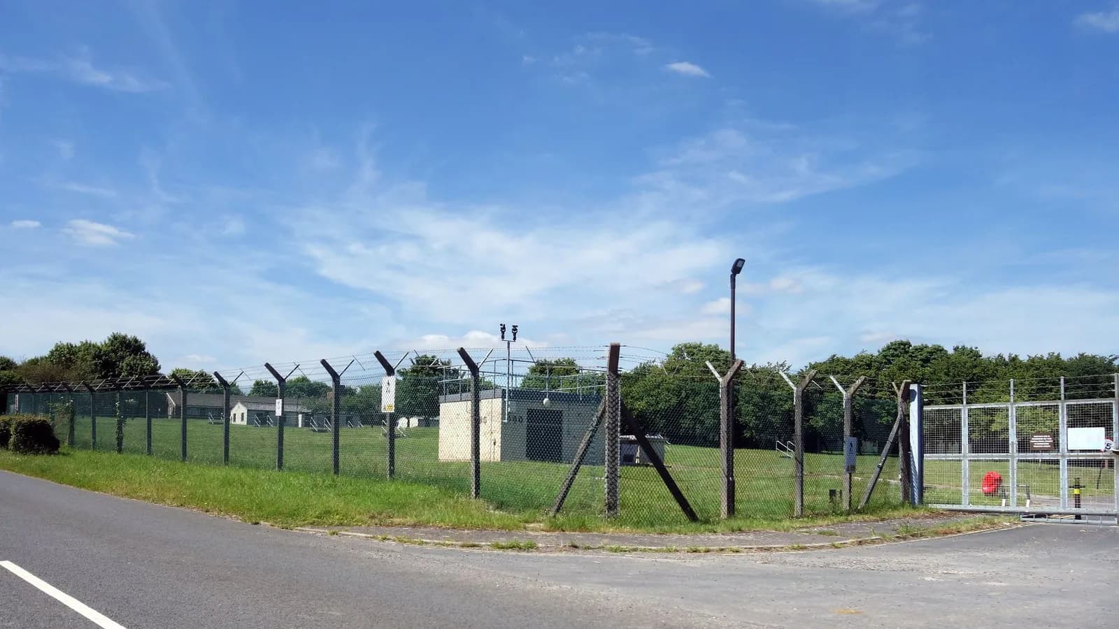 A security fence around RAF Fairford in Gloucestershire, the air base near which the five men were arrested, photographed in June 2022