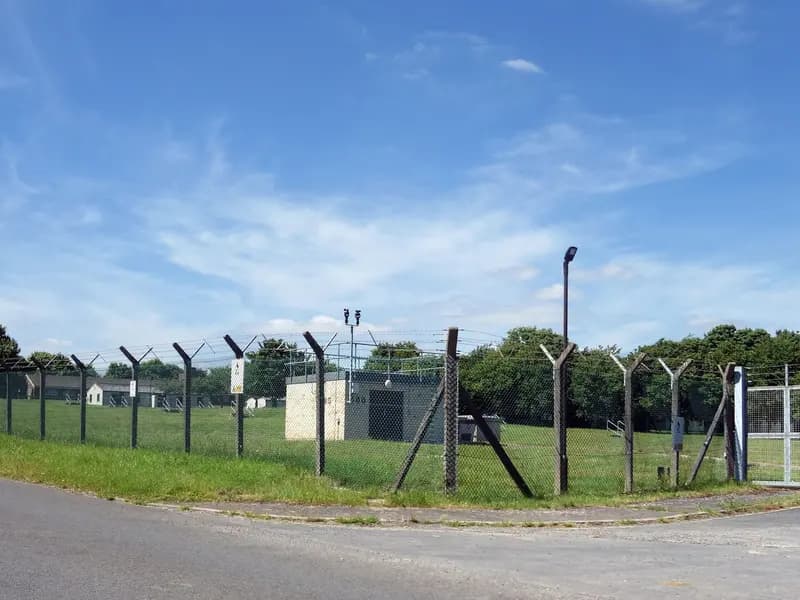 A security fence around RAF Fairford in Gloucestershire, the air base near which the five men were arrested, photographed in June 2022