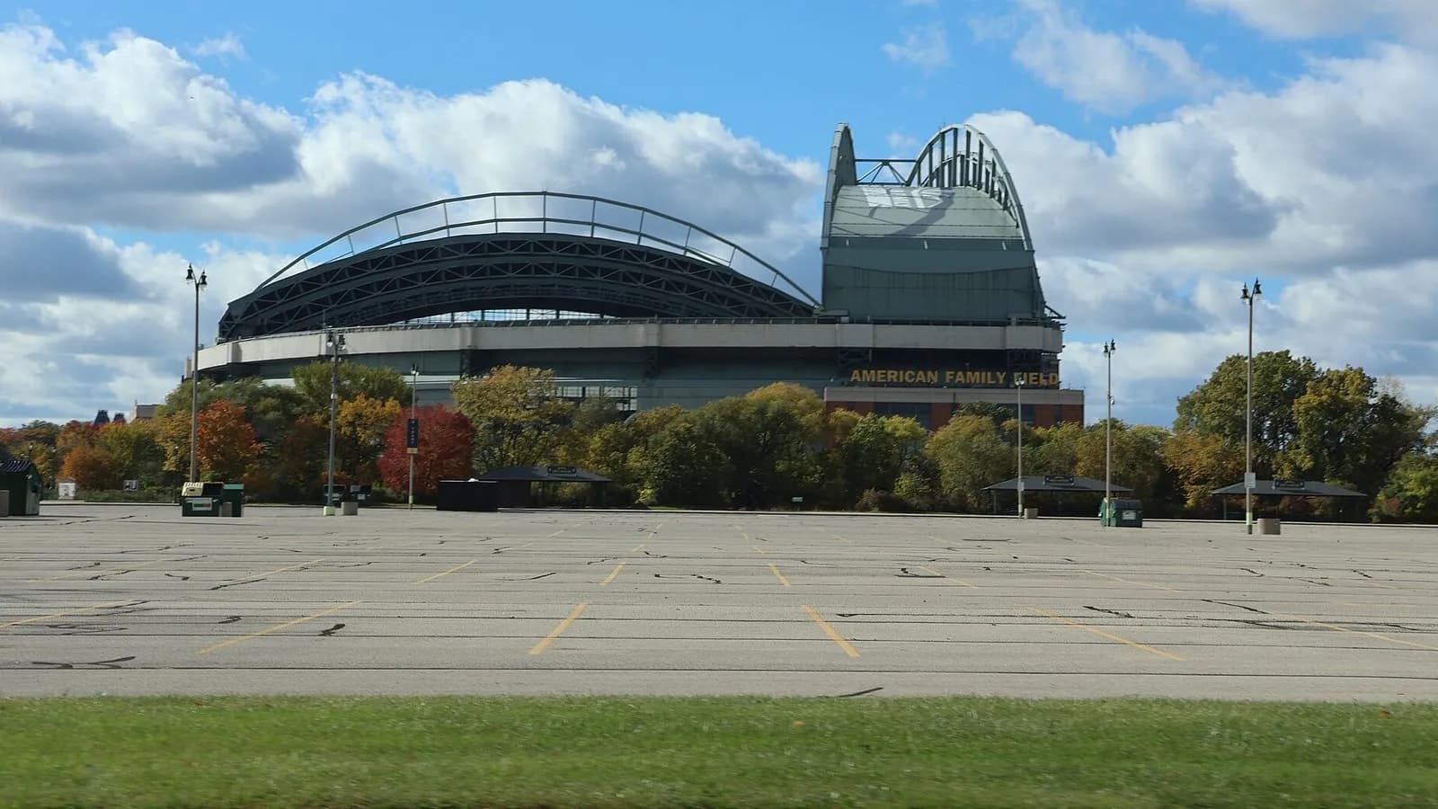 American Family Field in Milwaukee, home of the Brewers, with its retractable roof seen across an empty car park under a cloudy sky, photographed on 20 October 2023, a file photograph of the ballpark and not from this year's playoffs