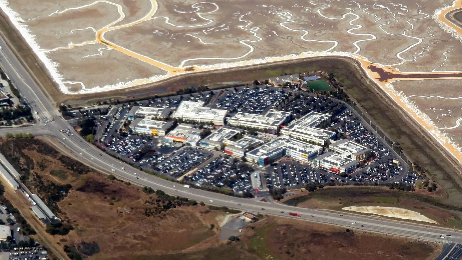 An aerial view of Meta's Menlo Park campus, then the Facebook campus, a cluster of low office buildings and car parks beside salt ponds in California, photographed on 17 September 2019, a file photograph of Meta's base and not of the model launches