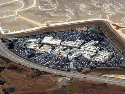 An aerial view of Meta's Menlo Park campus, then the Facebook campus, a cluster of low office buildings and car parks beside salt ponds in California, photographed on 17 September 2019, a file photograph of Meta's base and not of the model launches