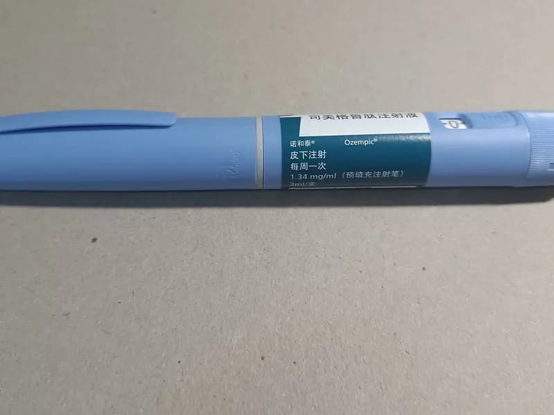 A pale blue Ozempic semaglutide injection pen lying on a grey surface, photographed on 30 June 2023, a file photograph of the comparator drug named in the trial and not of retatrutide, which is not approved