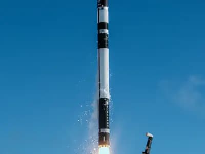 A Rocket Lab Electron rocket lifting off against a blue sky with a plume of exhaust at its base, photographed on 7 May 2023 by NASA and Rocket Lab, a file photograph of the company's smaller Electron and not of the Neutron rocket