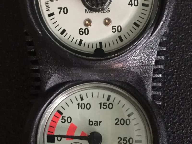 A close-up of a depth gauge reading in metres above a submersible pressure gauge reading in bar on a scuba console, photographed on 10 July 2017, a file photograph of the instruments used to track gas