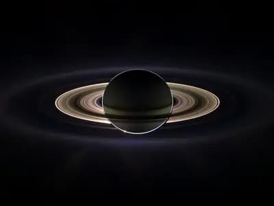 Saturn eclipsing the Sun as seen by the Cassini spacecraft in September 2006, with the rings lit from behind, a spacecraft view and not what a telescope shows from Earth