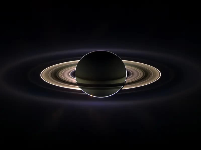 Saturn eclipsing the Sun as seen by the Cassini spacecraft in September 2006, with the rings lit from behind, a spacecraft view and not what a telescope shows from Earth