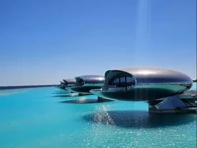 An overwater luxury resort villa on a coral atoll in the Red Sea off the Saudi coast