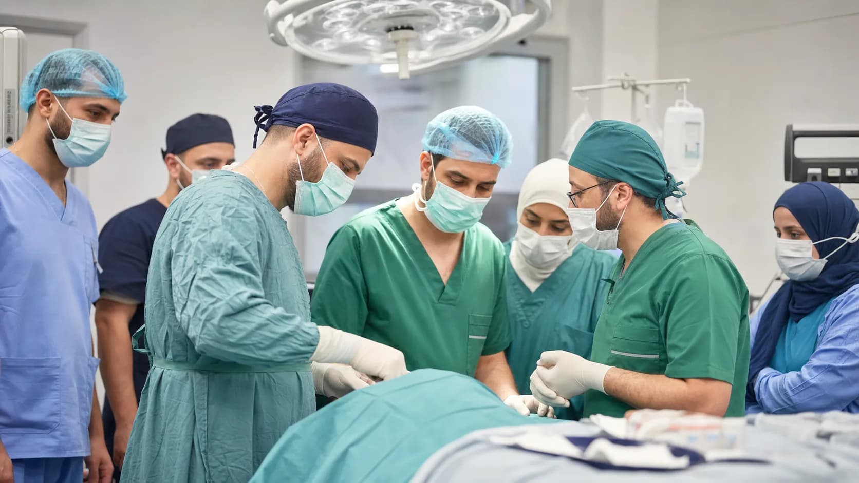 Volunteer surgeons and local medical staff preparing for an urgent hospital procedure
