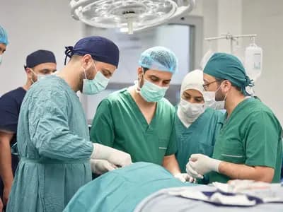 Volunteer surgeons and local medical staff preparing for an urgent hospital procedure
