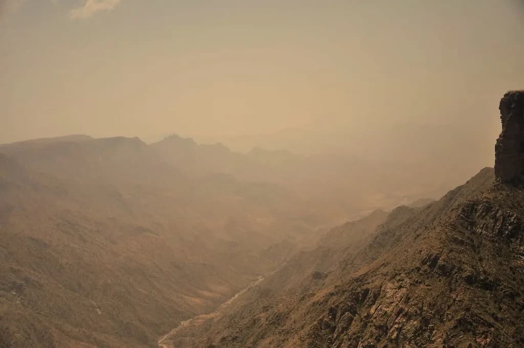 Mountain and coastal landscapes representing Saudi Arabia's nature tourism