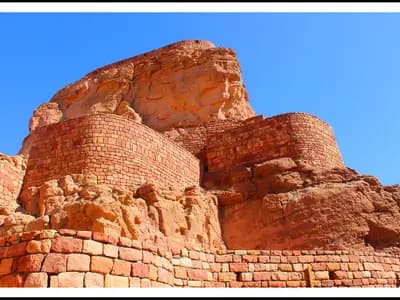 Travelers exploring Saudi Arabia's desert landscape