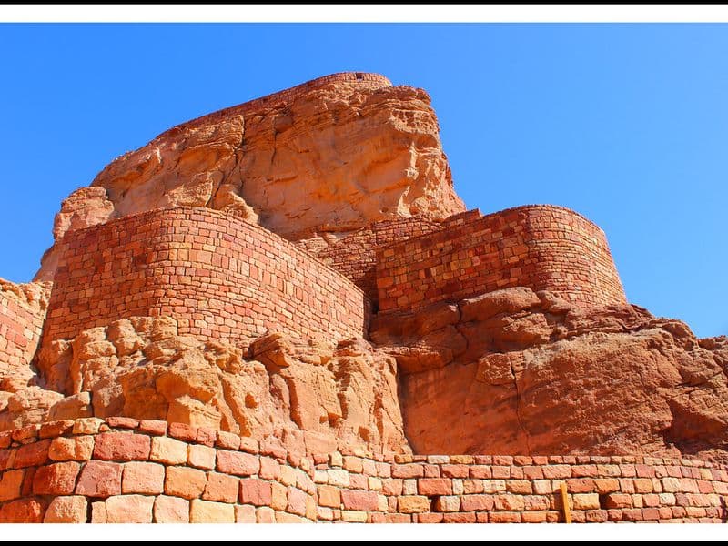 Travelers exploring Saudi Arabia's desert landscape