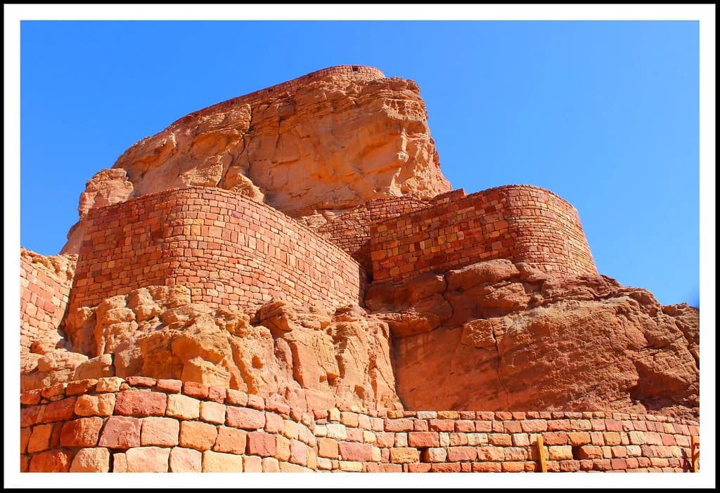 Travelers exploring Saudi Arabia's desert landscape