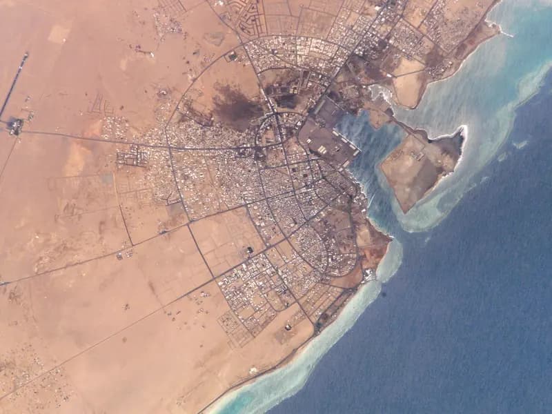The port and city of Yanbu on Saudi Arabia's Red Sea coast, where the East-West pipeline ends, seen from the International Space Station in 2002