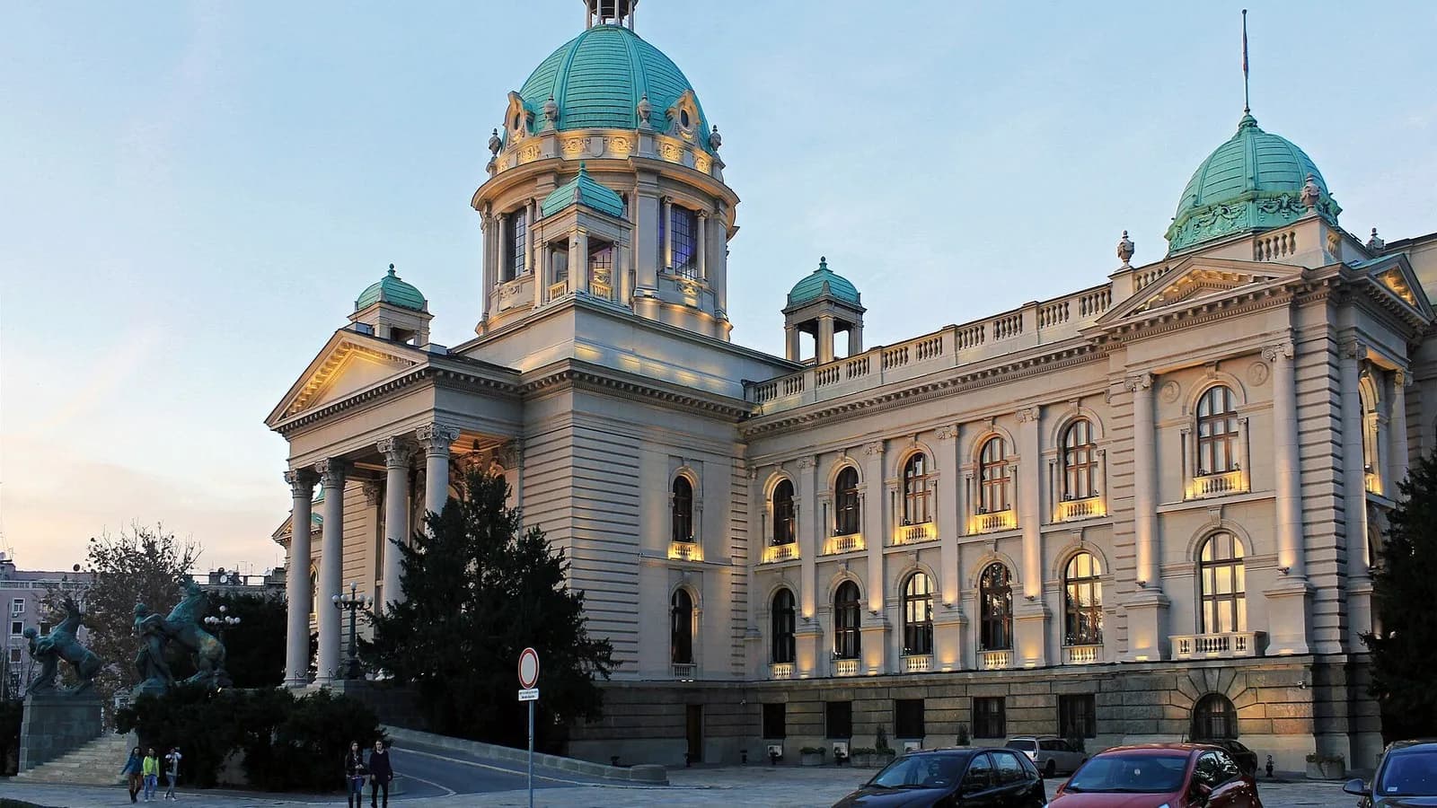 The House of the National Assembly of Serbia in Belgrade at dusk with its green copper domes and lit windows, photographed on 25 October 2015, a file photograph of the parliament building and not of this year's voting