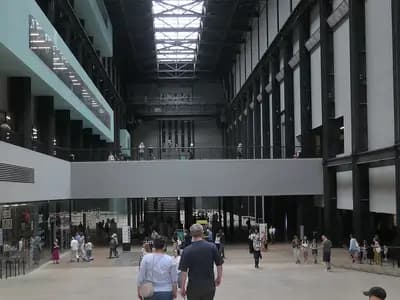Visitors in the Turbine Hall at Tate Modern in London under the skylight, photographed in August 2026, a file photograph of the hall before the new commission and not of Hold