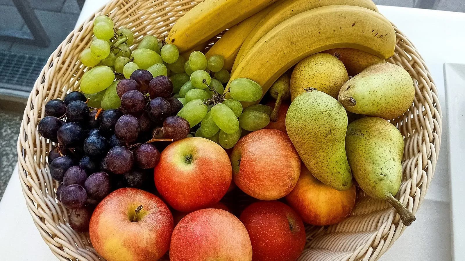 A wicker basket of bananas, grapes, pears and apples on a table, photographed on 10 September 2022, a file photograph illustrative of fruit and not of the study's participants