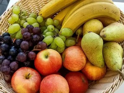 A wicker basket of bananas, grapes, pears and apples on a table, photographed on 10 September 2022, a file photograph illustrative of fruit and not of the study's participants