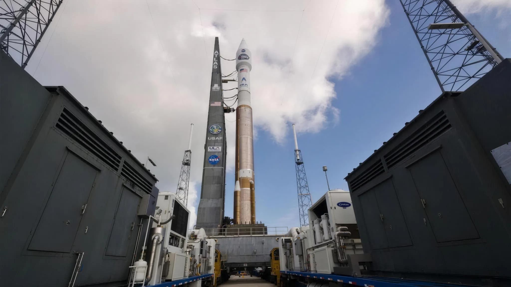 A rocket standing on a launch pad at dusk