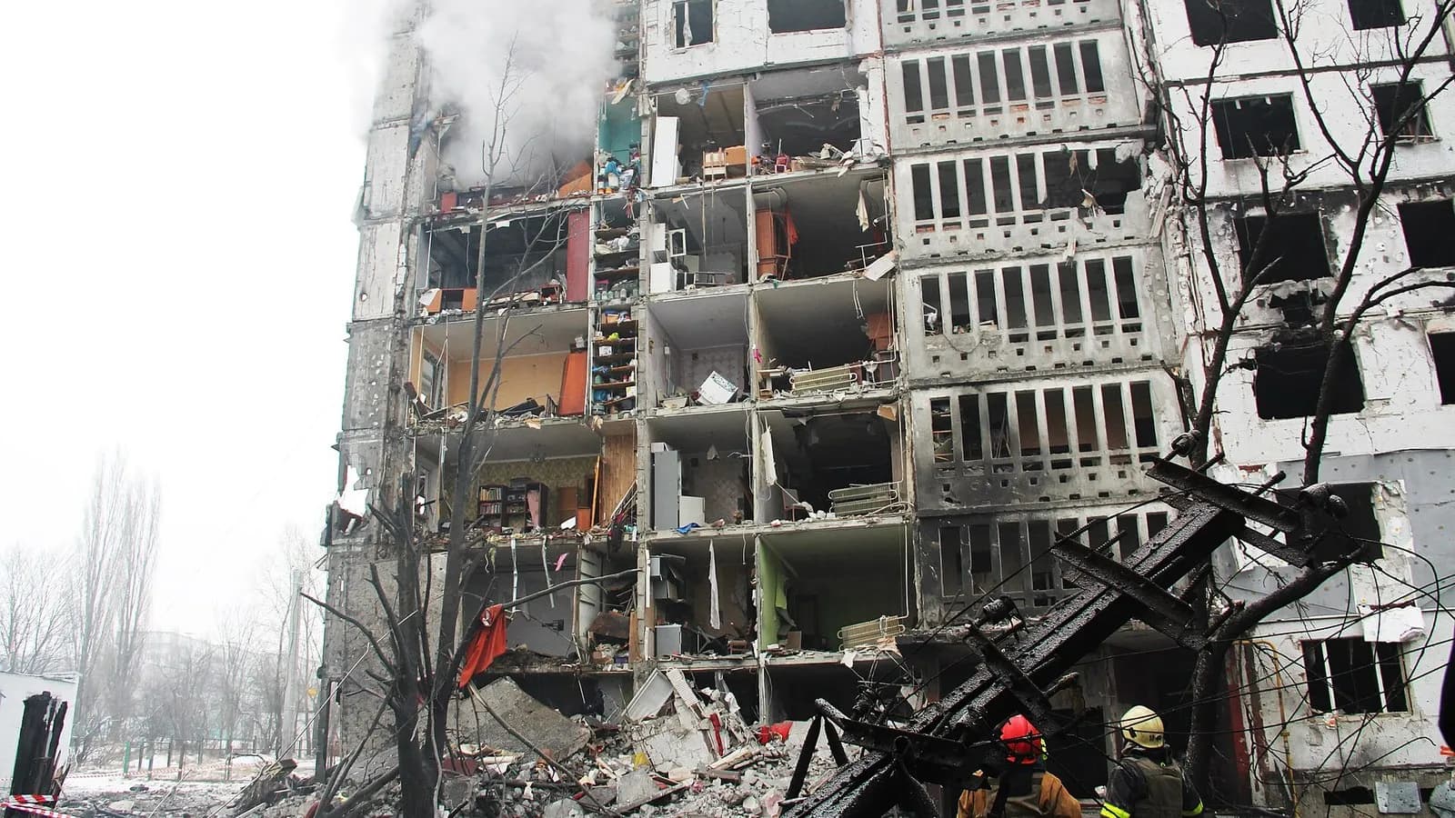 Firefighters at a damaged apartment block in Kharkiv, Ukraine, after a Russian attack, photographed on 23 January 2024, a file photograph illustrative of attacks on the city and not of this week's strikes on energy sites