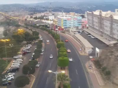A road and low-rise buildings in the hill city of Abha in south-western Saudi Arabia at dusk, photographed on 11 January 2013, a file photograph of the Asir region where the missile debris fell and not of Sunday's events