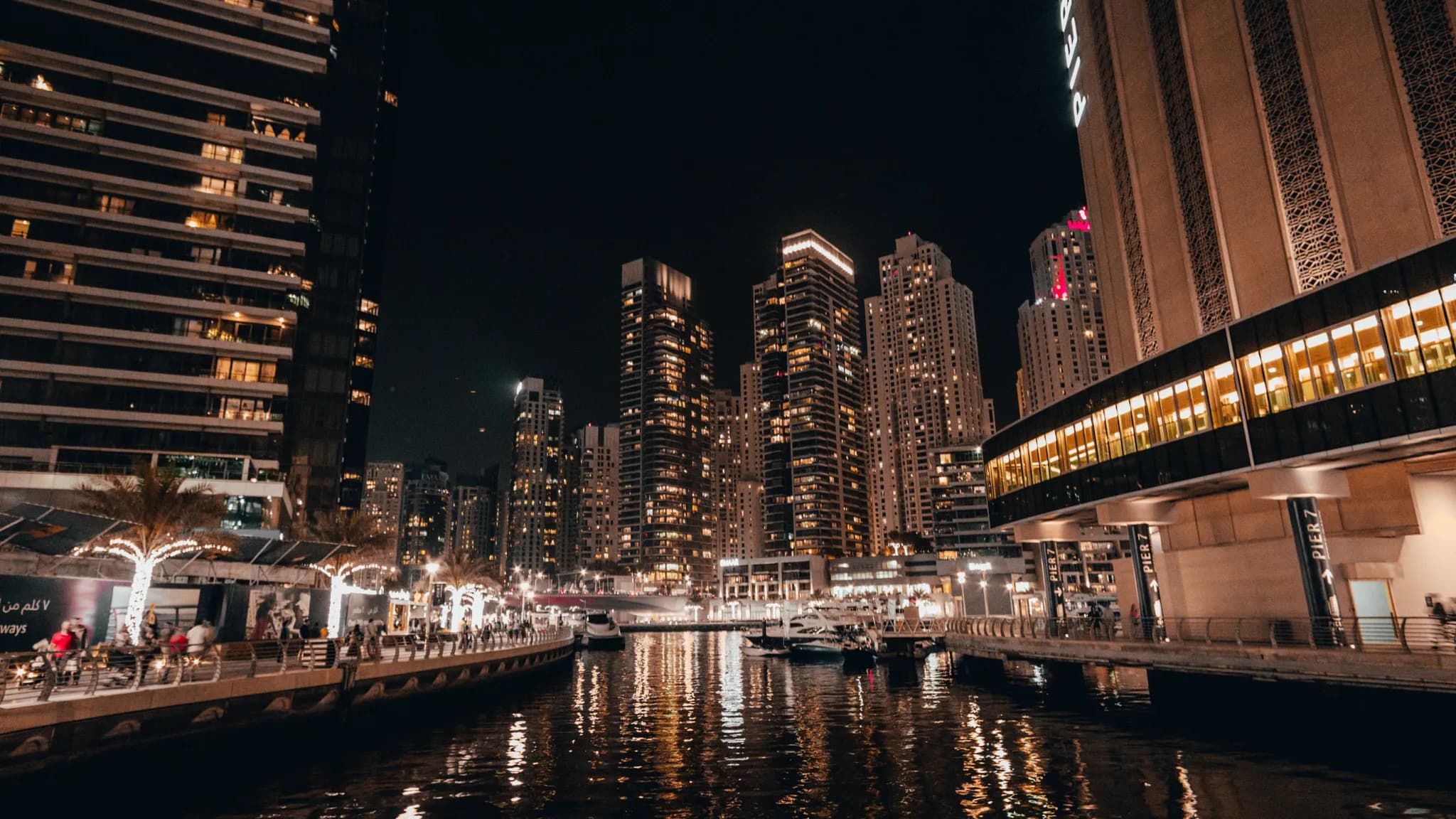 The Dubai skyline at dusk with illuminated skyscrapers, representing the UAE's push into regulated digital currency