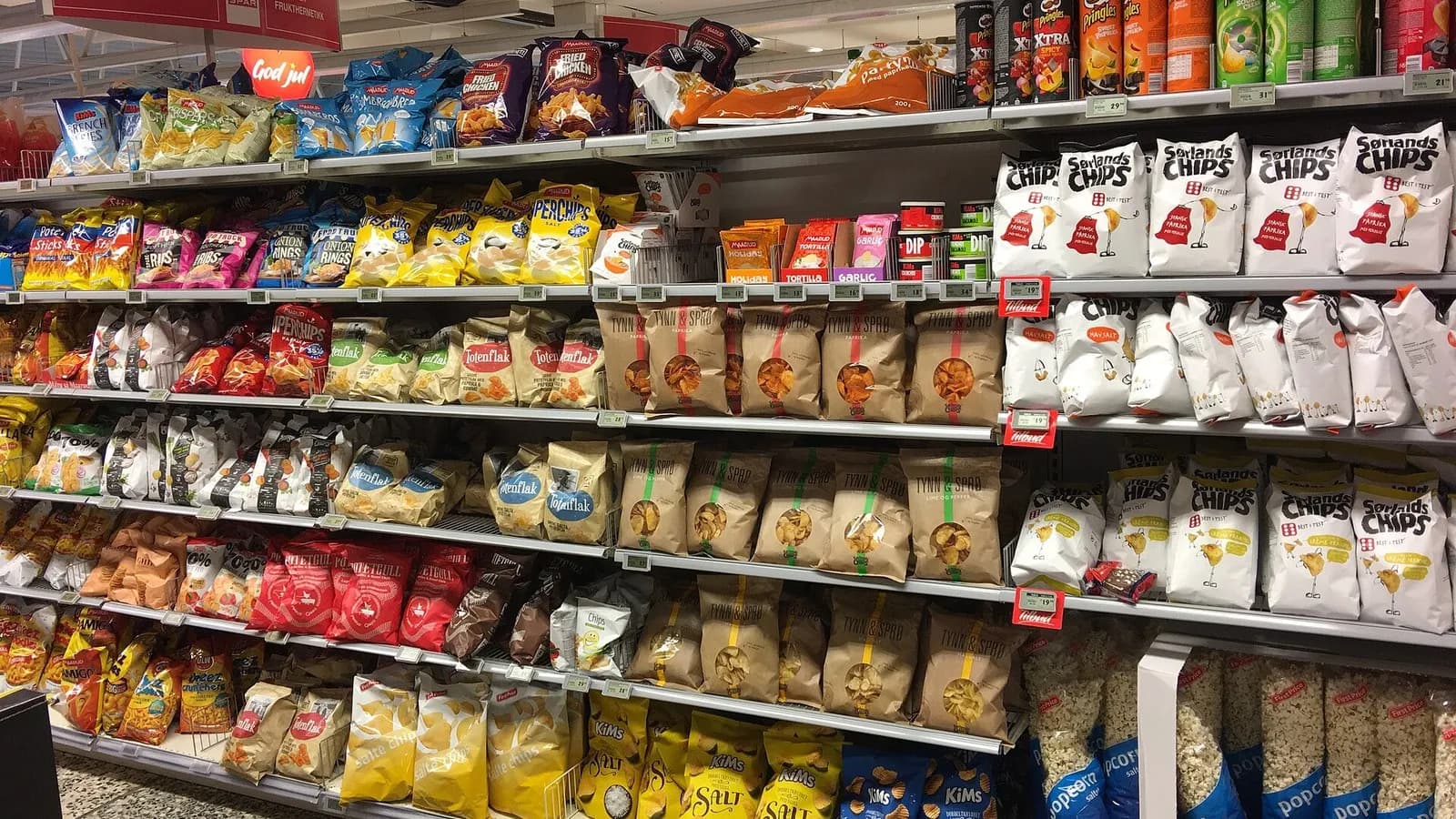 Shelves of packaged crisps and other snacks in an aisle of a supermarket in Tjome, Norway, photographed on 5 December 2017, a file photograph illustrative of packaged snack foods and not of the study participants