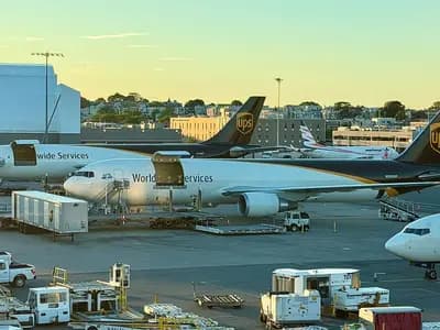 UPS Airlines Boeing 767 freighters parked on an airport apron beside a Delta jet, photographed on 19 June 2026, a file photograph illustrative of UPS's air network and not of this week's results
