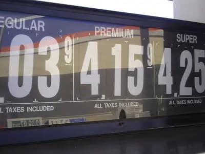 A gasoline price board reading $4.03, $4.15 and $4.25 for regular, premium and super at a Cumberland Farms station in Lewiston, Maine, an undated file photograph illustrative of US pump prices and not of September's inflation data