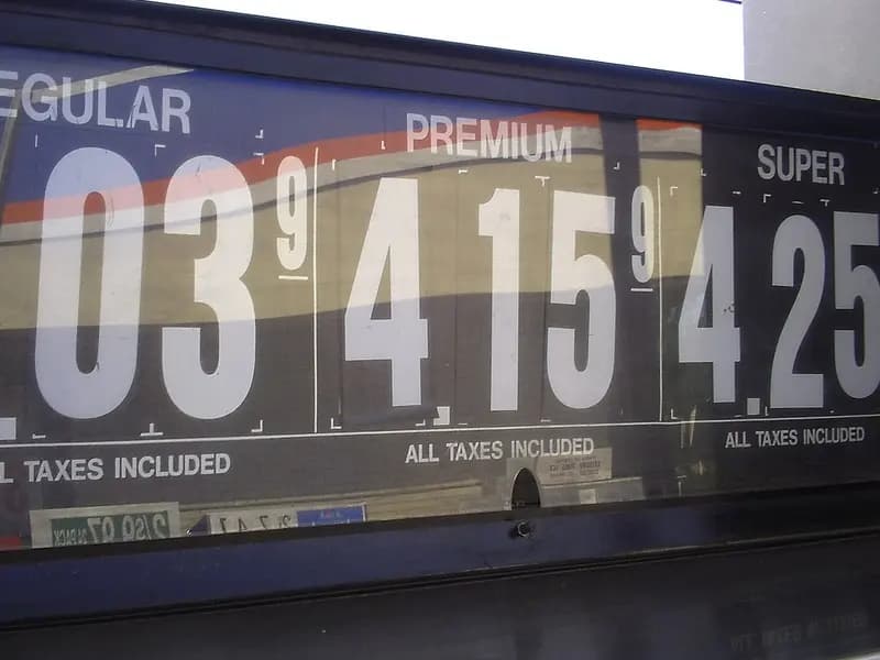 A gasoline price board reading $4.03, $4.15 and $4.25 for regular, premium and super at a Cumberland Farms station in Lewiston, Maine, an undated file photograph illustrative of US pump prices and not of September's inflation data
