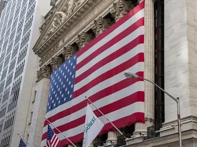 The facade of the New York Stock Exchange on Wall Street in New York City with a large American flag, photographed in July 2012, a file photograph and not from Monday's trading