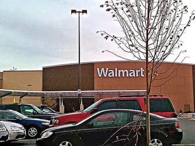 The brown brick front of a Walmart Supercenter in Laurel, Maryland, with the company name on the wall above a car park with cars and a bare tree, photographed on 30 October 2010, a file photograph illustrative of a Walmart store and not of the Agent Gateway