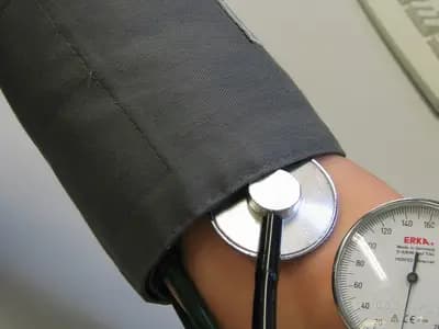 A blood pressure reading being taken on an upper arm with a cuff, an aneroid gauge and a stethoscope, photographed in 2009, a file photograph illustrative of routine blood pressure checks and not of any patient in this report